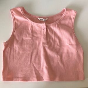 A pink cropped tank top.